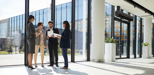 Business people in office building lobby