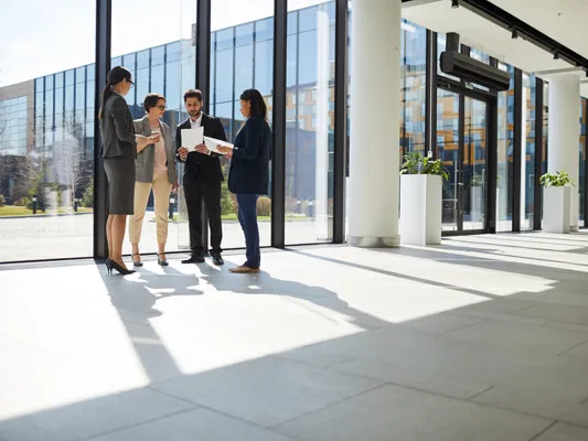 Business people in office building lobby